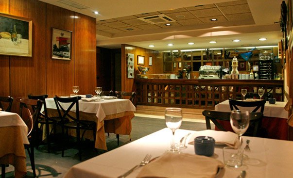 Wood-paneled dining room at Casa Hortensia