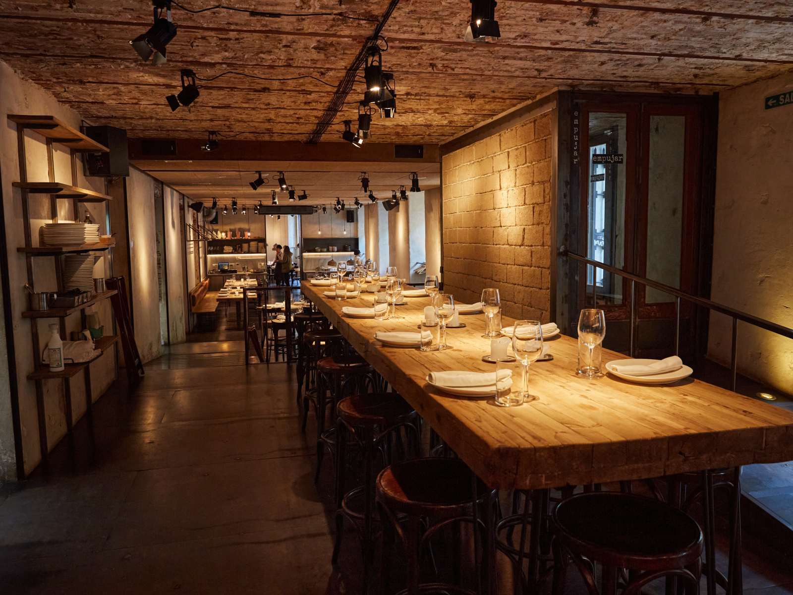 Long shared table set for dinner at Fismuler