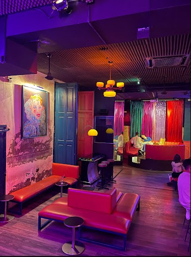 Interior of Candy Darling with red banquettes and stage