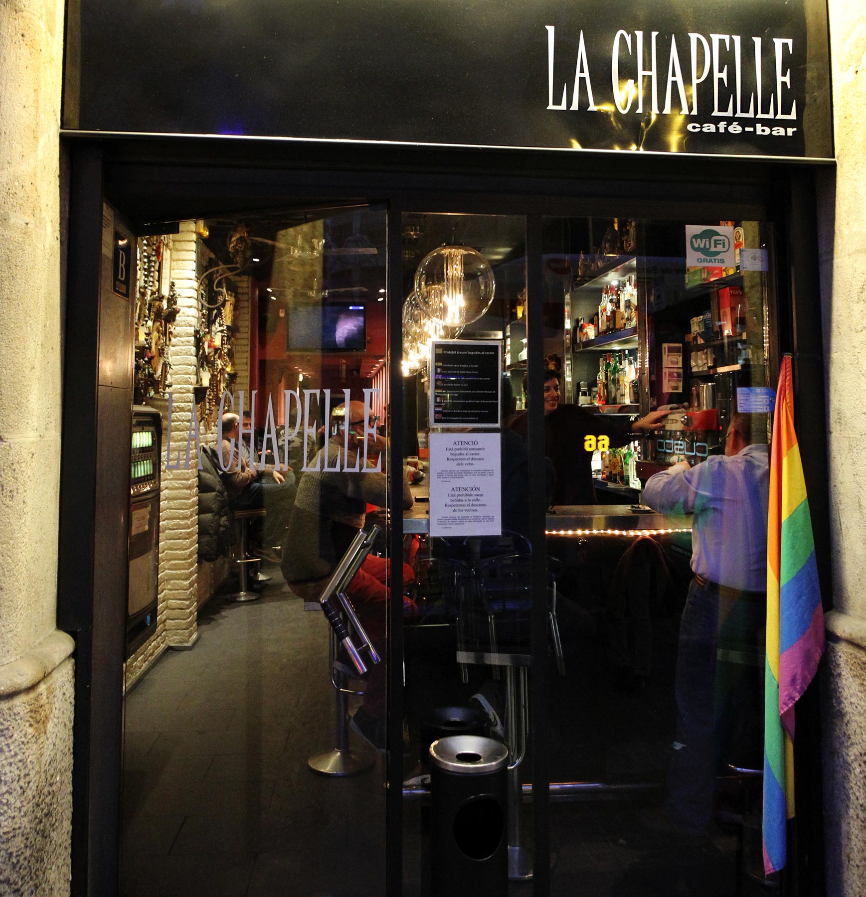 La Chapelle entrance at night with rainbow flag