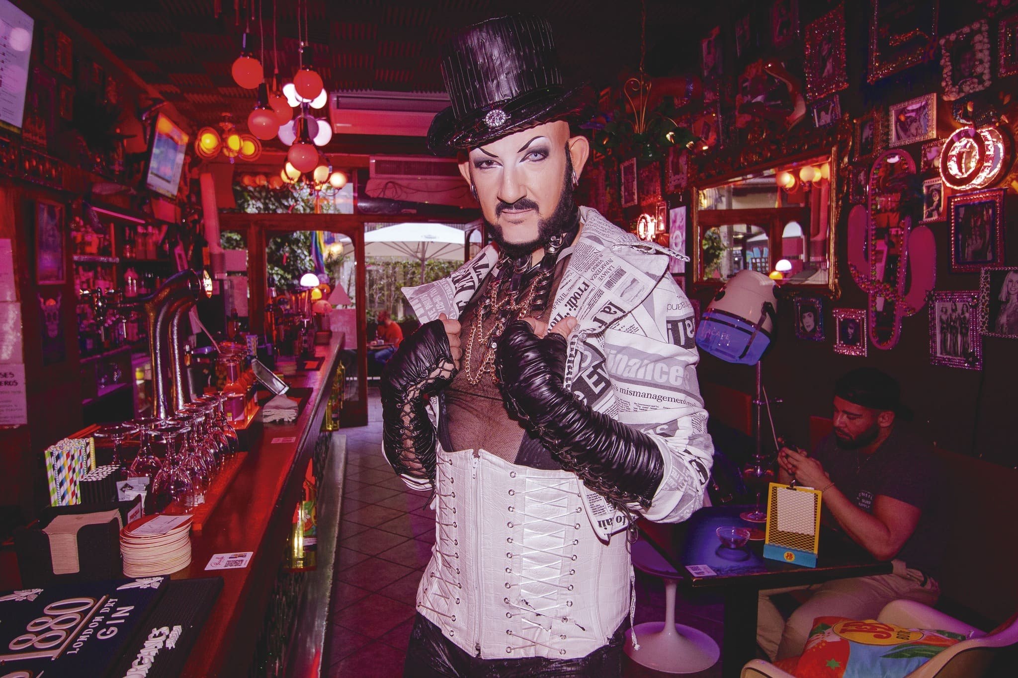 Camp interior of Priscilla bar with drag performer
