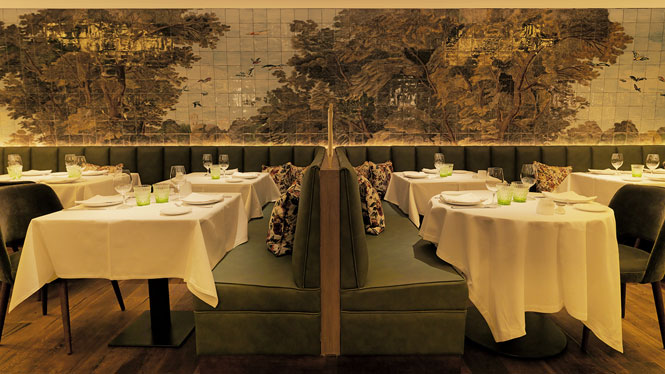 Banquette seating under a botanical mural at L'Olivé
