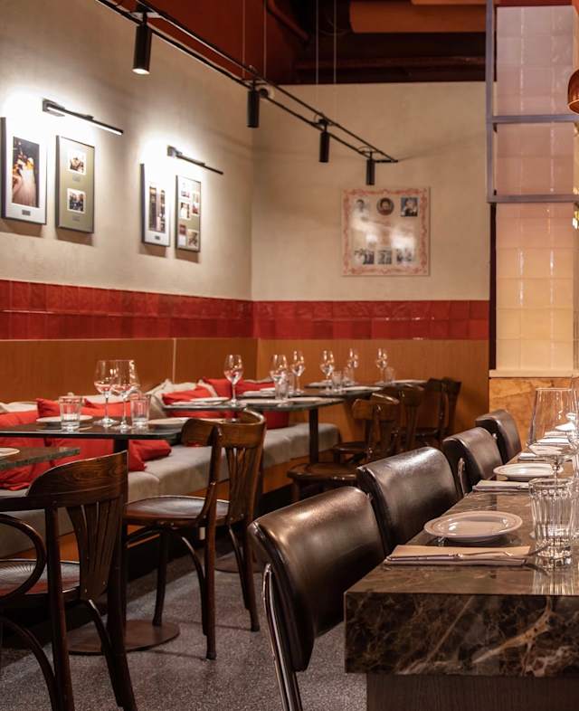 Plant-filled dining room at Madre Taberna Moderna