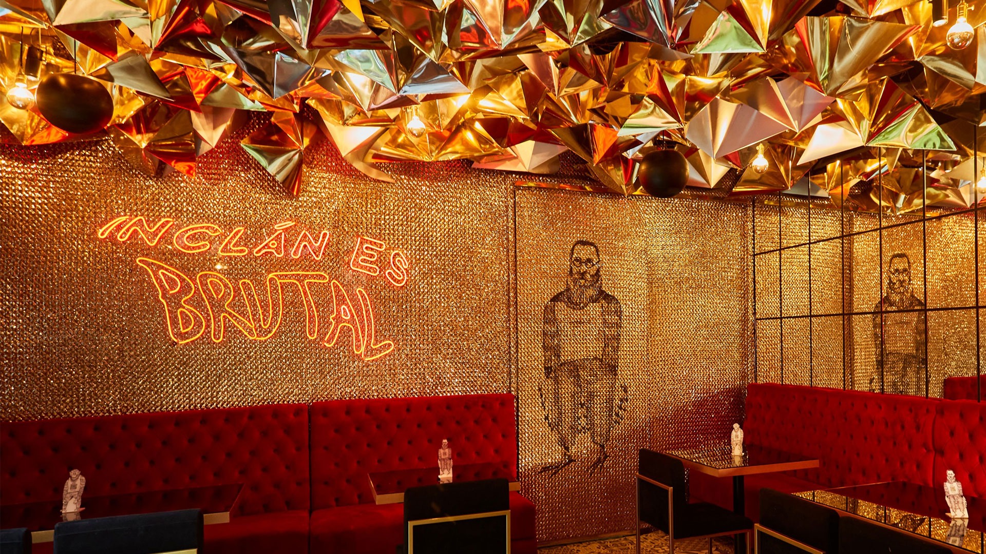Golden ceiling and red velvet seating at Inclán Brutal Bar