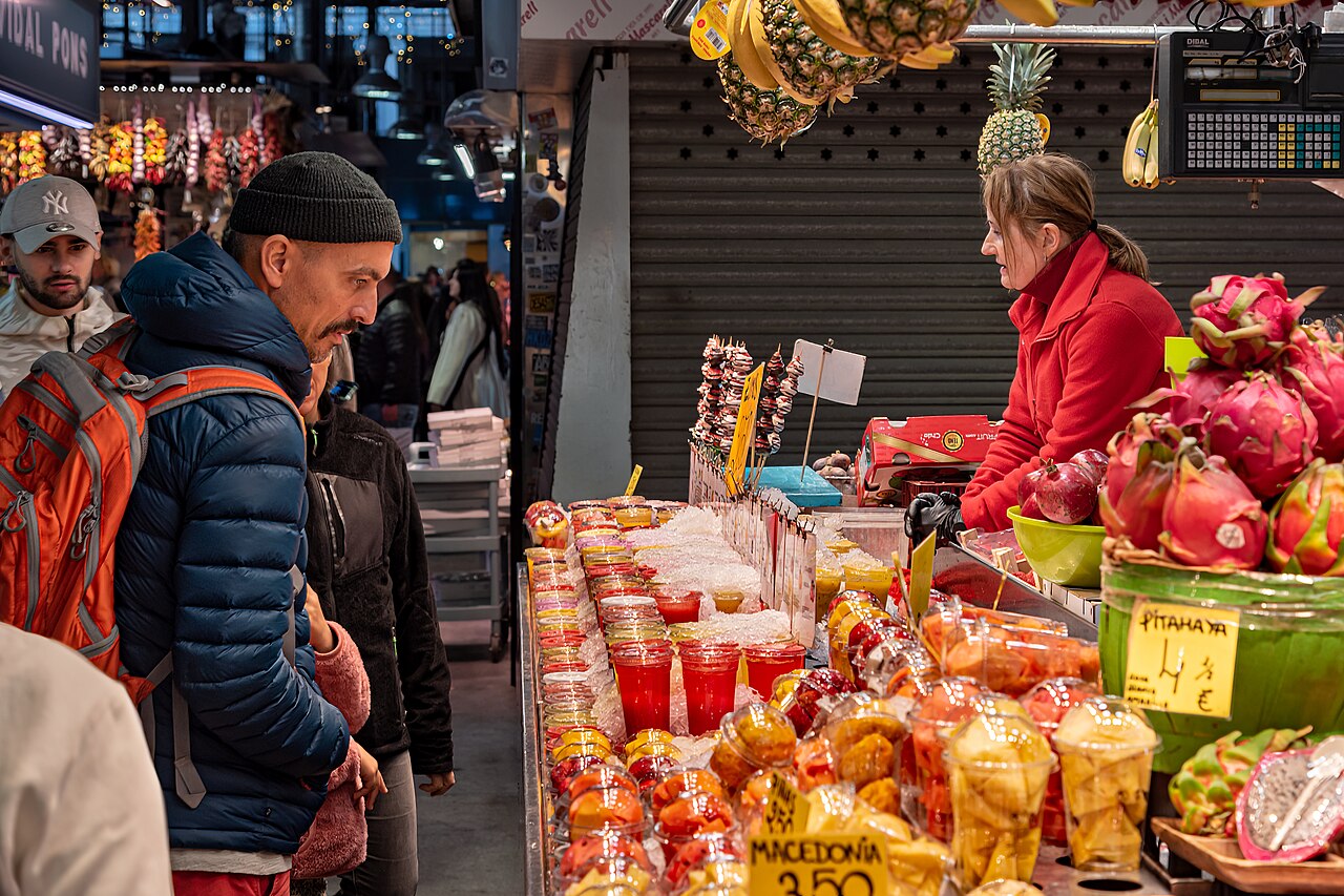 A colorful fruit stall inside La Boqueria market in Barcelona