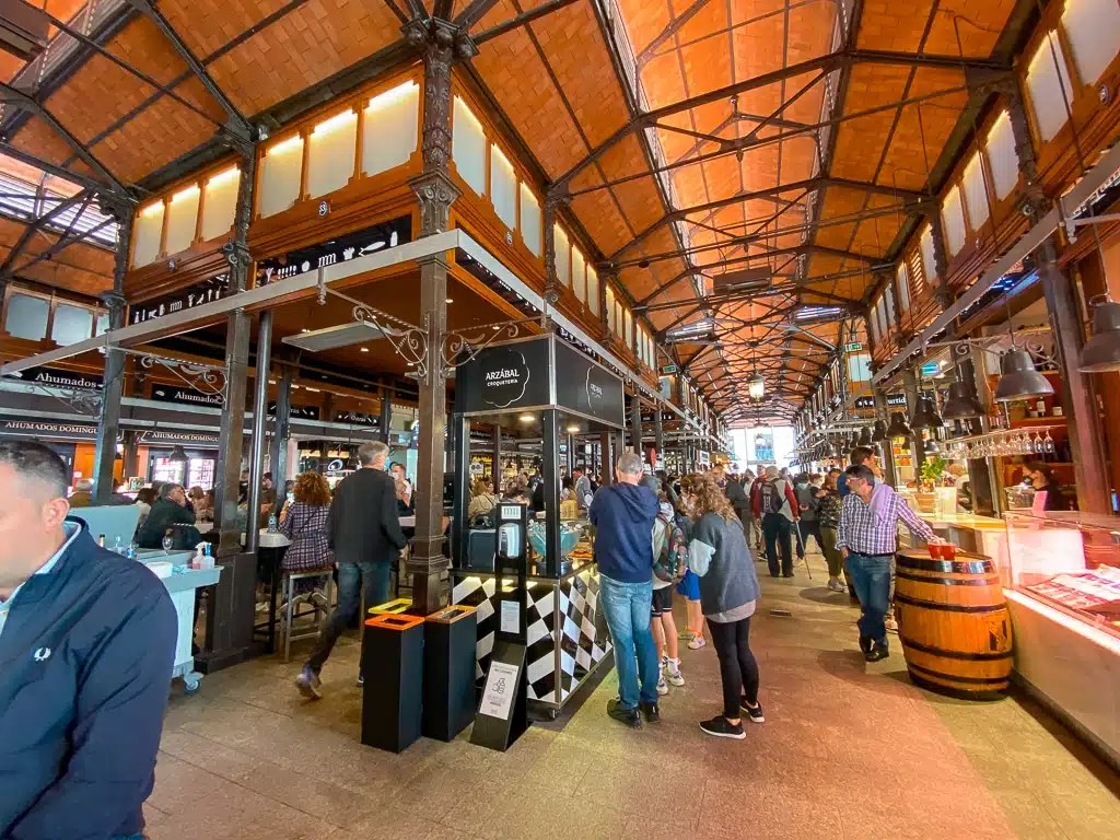 Food stalls and shoppers at Mercado de San Miguel